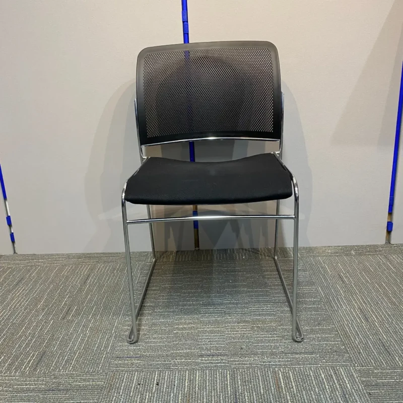 Black meeting chair with fabricated seat and plastic mesh back
