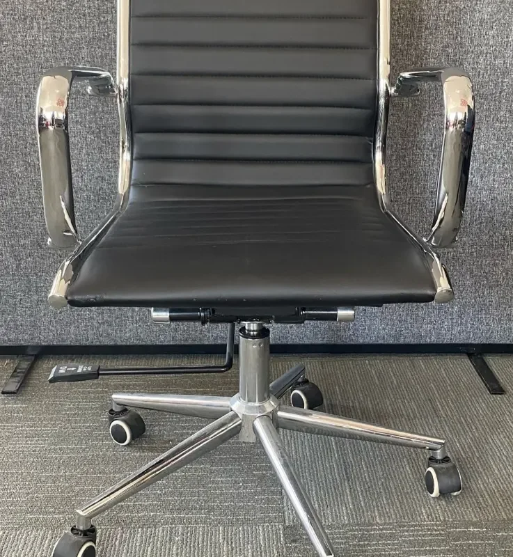 Black Faux Leather Meeting Chair With Chrome Arms and Five Star Base